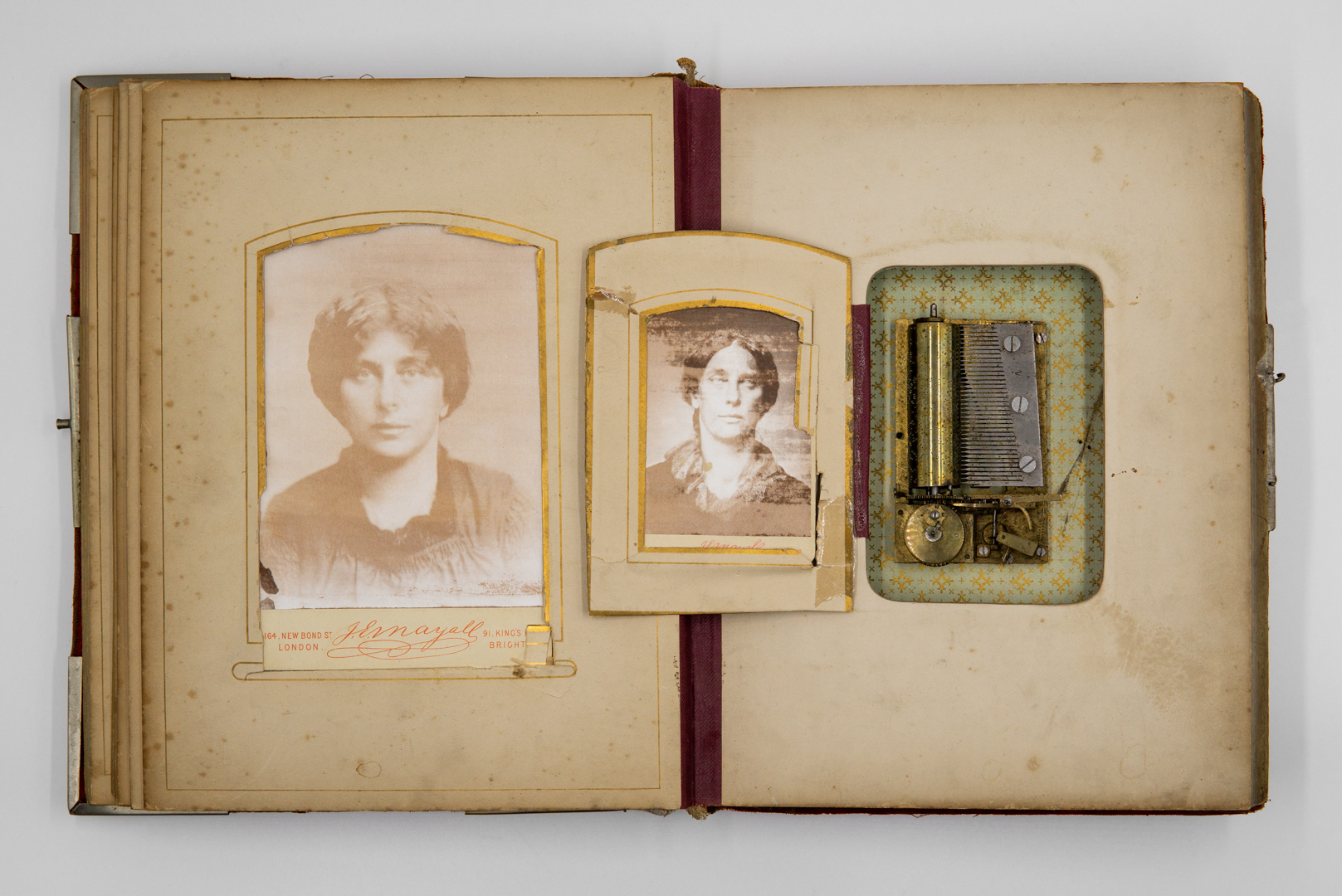 Antique photoalbum with a functioning music box and two albumen prints. On the left page a cabinet card mounted on the original card of the photographer JE Mayall who photographed Jane Morris in the 1880s. On the right page a carte de visité on the original card by JE Mayall. Margje Bijl recreated his photo of Jane Morris with wetplate collodion photographer Gerjo te Linde. The album was shown during the group exhibition 'Time, Timeless, Movement' at Gallery Pulchri.